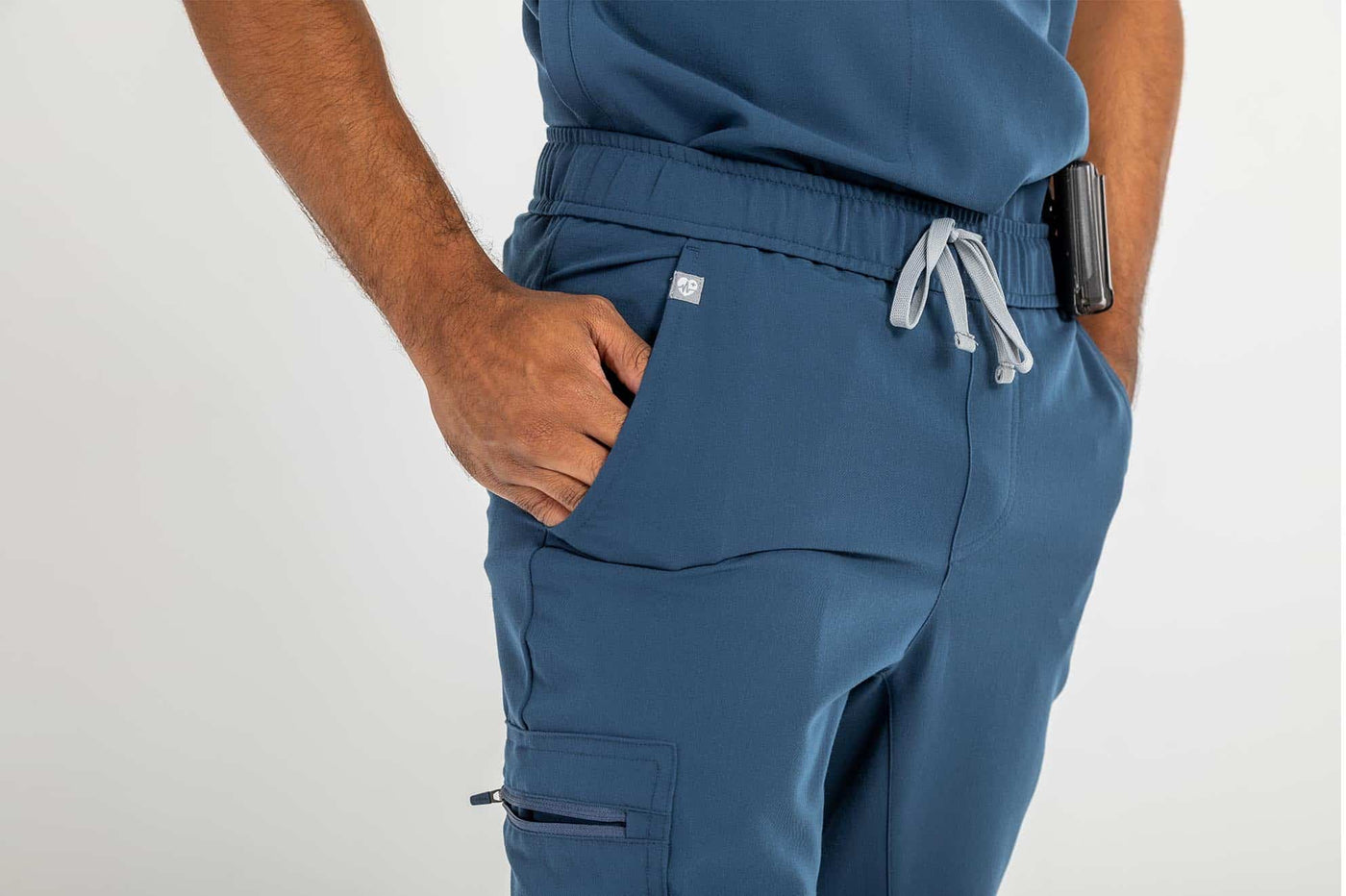 Men's DEX Jogger Scrub Pant, Navy Blue Pants, Featuring side pockets of the scrub pant#colour_navy-blue