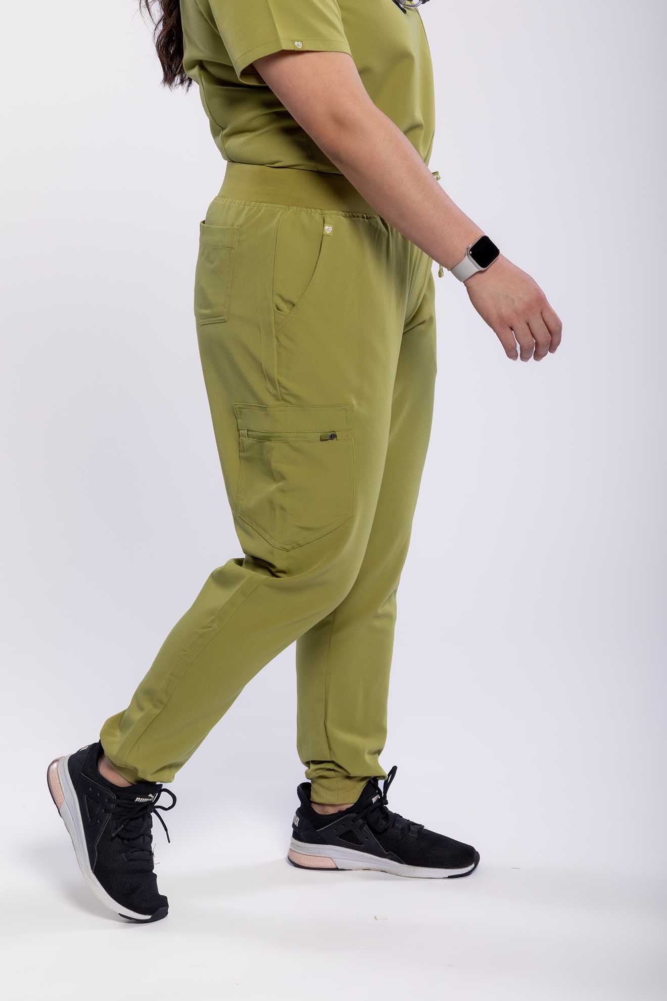 Women's SAYA Jogger Scrub Pant in olive colour featuring side angle #colour_olive