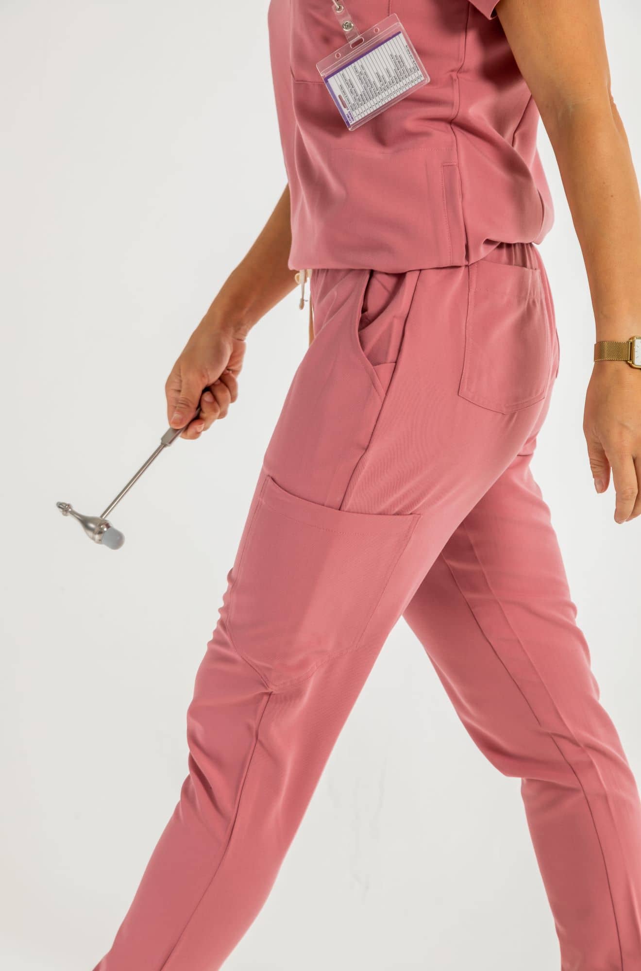 Women's SAYA Jogger Scrub Pant, Rose Pants, lady holding tool#colour_rose