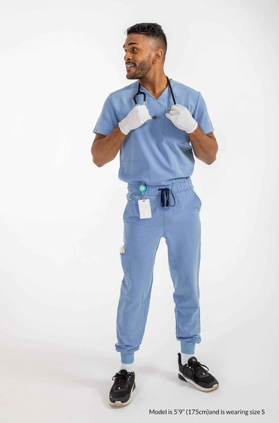 Men's DEX Jogger Scrub Pants, Gentleman holding stethoscope on his neck #colour_ceil-blue