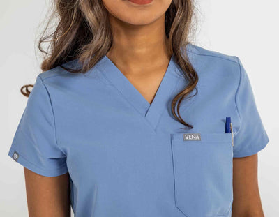 Women's ATRIUM Scrub Top, lady featuring zoom image of scrub shirt#colour_ceil-blue