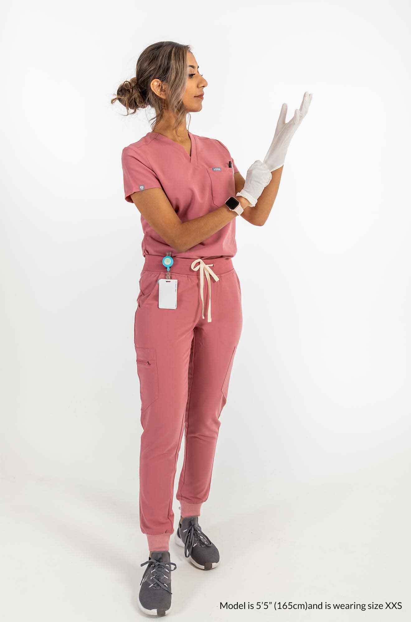 Women's ATRIUM Scrub Top, Lady is wearing gloves on both hands #colour_rose