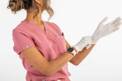 Women's ATRIUM Scrub Top, Rose Shirt, Lady wearing gloves on her hand#colour_rose