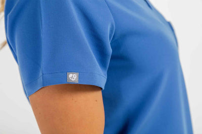 Women's ATRIUM Scrub Top, Royal Blue Shirt, Featuring left side of scrub shirt#colour_royal-blue