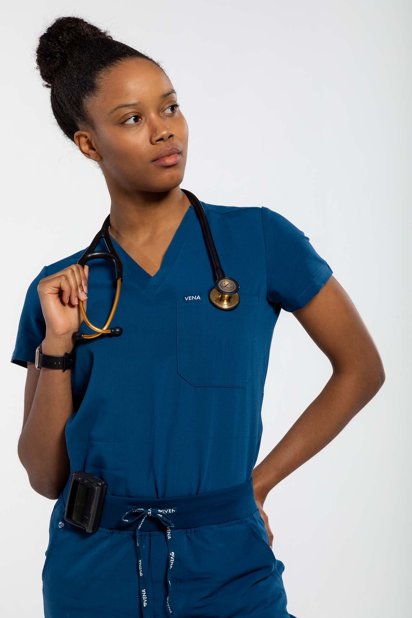 Vena Scrub top in navy lady holding stethoscope#colour_navy-blue